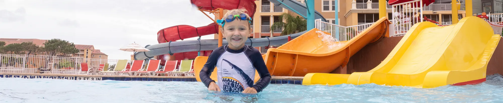 A child in the pool beside the waterslides at Westgate